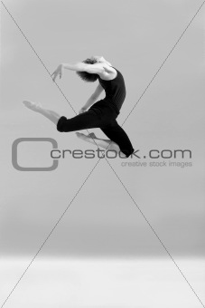Studio picture of boy jumping high when dancing