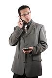 Businessman on the PDA phone with an ear piece