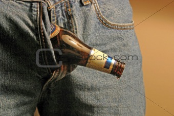 Man with beer bottle coming out of pants zipper.