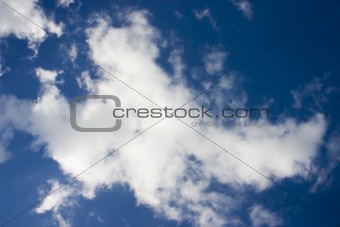 Deep blue sky with white clouds