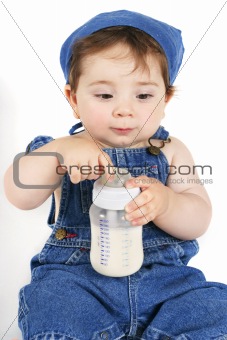 Sitting baby with milk