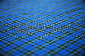 blue checkered celtic fabric textured background. shallow DOF.