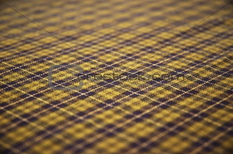 checkered celtic fabric textured background. shallow DOF.