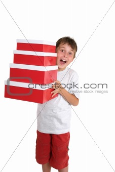 Excited child carrying gift boxes