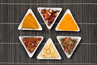 Assortment of spices over a bamboo mat