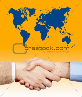 Business handshake under the world