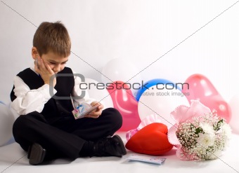 The boy reflects on a congratulation to the Valentine's day 