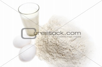Flour, egg and a glass of milk