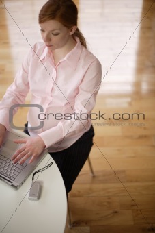 sitting at a desk