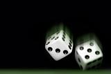 Rolling Two dices on black background