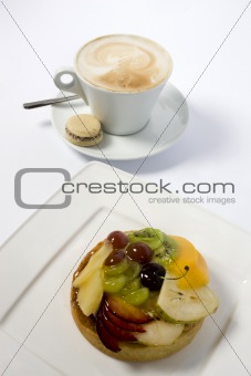 fruit cake and coffee cup