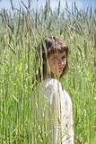 young girl in high grass field