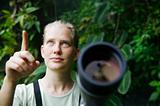 Pretty Woman with Telescope in the Rain Forest