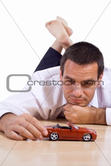 Man with red toy car