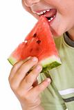 Boy eating watermelon slice