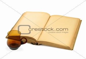 open blank book with teacup