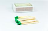 Green wooden matches over box