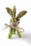 three asparagus spears tied by rope