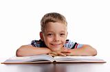 Smiling schoolboy with book