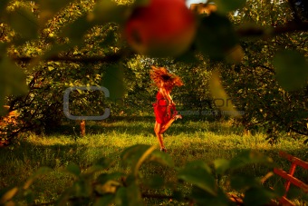 Woman in apple's garden