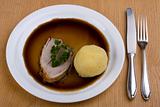 bavarian roast pork dish with potato dumpling