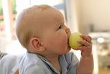 baby boy eating apple
