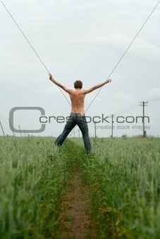 jumping in green field