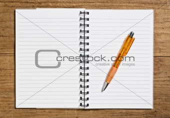 Open spiral notebook with pen.