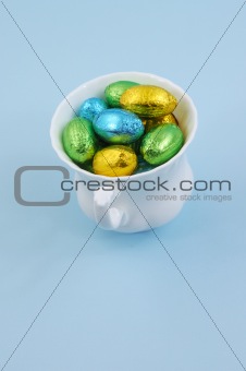Chocolate easter eggs in cup