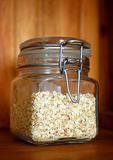 Glass jar of porridge oatmeal