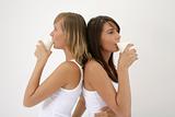 two girls drinking milk