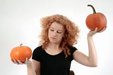 redhead holding pumpkins