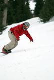 Snowboarder turn on ski slope