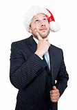 thinking businessman with santa cap