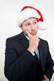 thinking businessman with santa cap