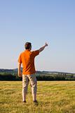 Man pointing with outstretched arm