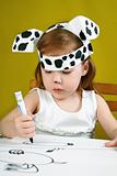 Small girl with dalmatian mask