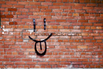Brick Wall and Smile Graffiti - Smile Graffiti on a Red Brick Wall.