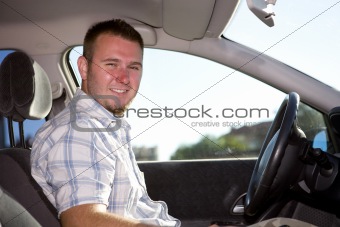 man in car