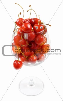 The glass filled by a sweet cherry