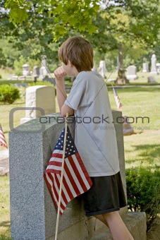 Boy Mourning at Gravesite