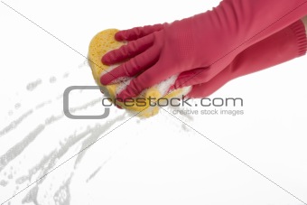 pink hand cleaning a mirror