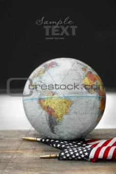 Globe and flag on school desk