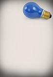 blue light bulb against abstract background