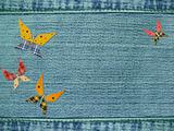 Jeans background with butterflies from rags