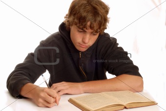 young teen boy doing homework