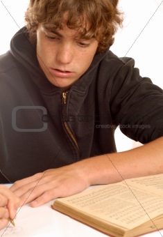 teen boy doing homework