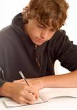 teen boy writing check