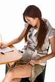 Asian schoolgirl is preparing to cheat on test