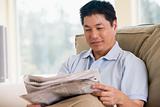 Man relaxing with a newspaper